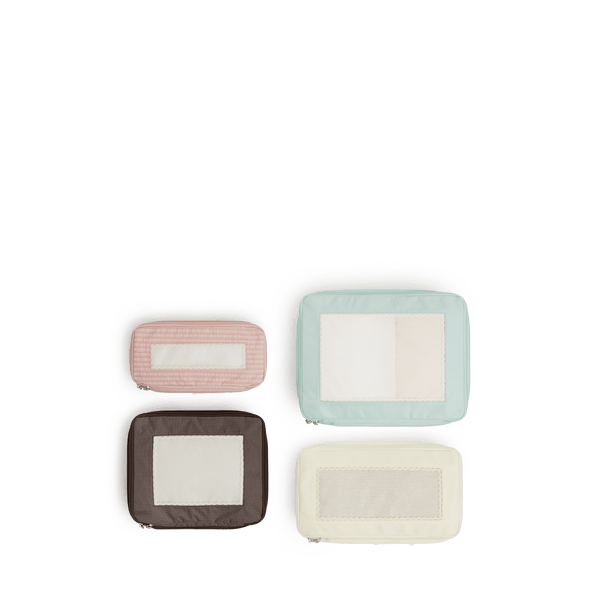 Set of Four / Multi Scaled | Set of four top view of Monos x Reformation compressible packing cubes in Multi colors