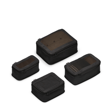 This is a photo of a set of four compressible packing cubes in black