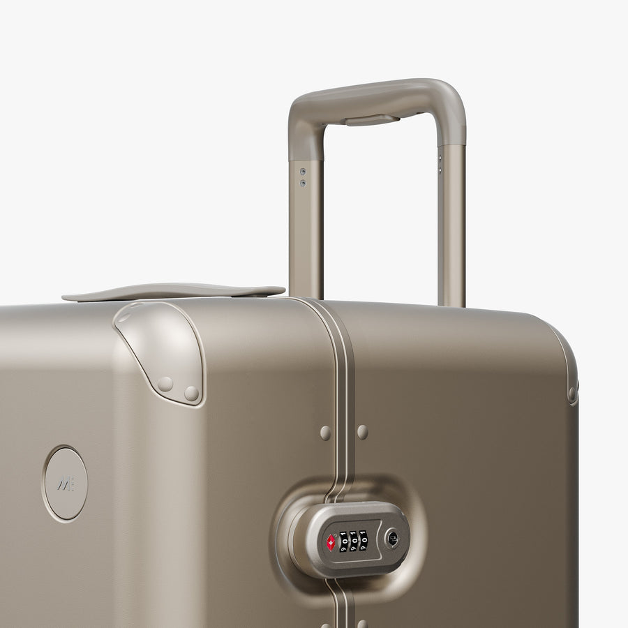 Champagne | Luggage handle view of Hybrid Trunk in Champagne