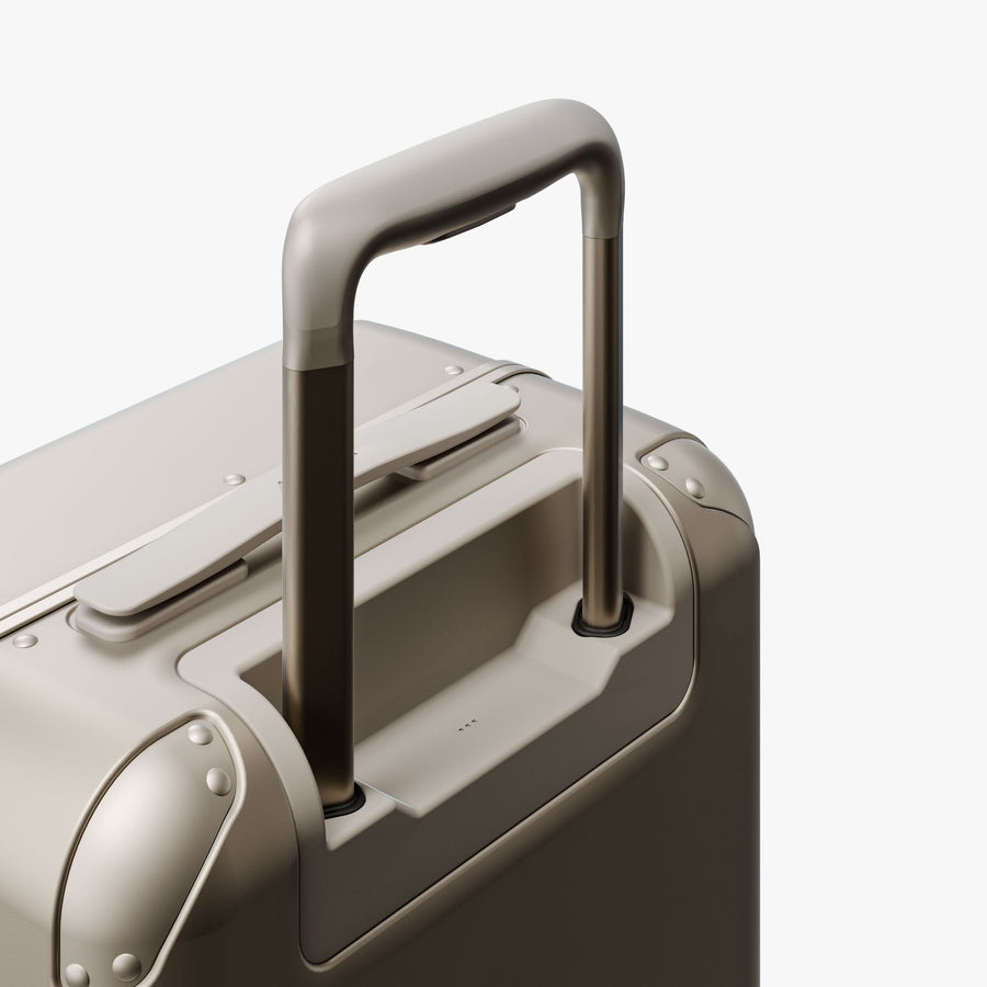 Champagne | Extended luggage handle view of Hybrid Carry-On in Champagne