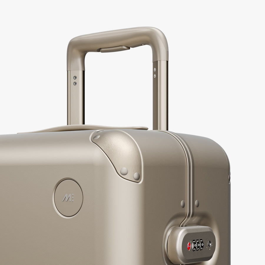 Champagne | Luggage handle view of Hybrid Carry-On Plus in Champagne