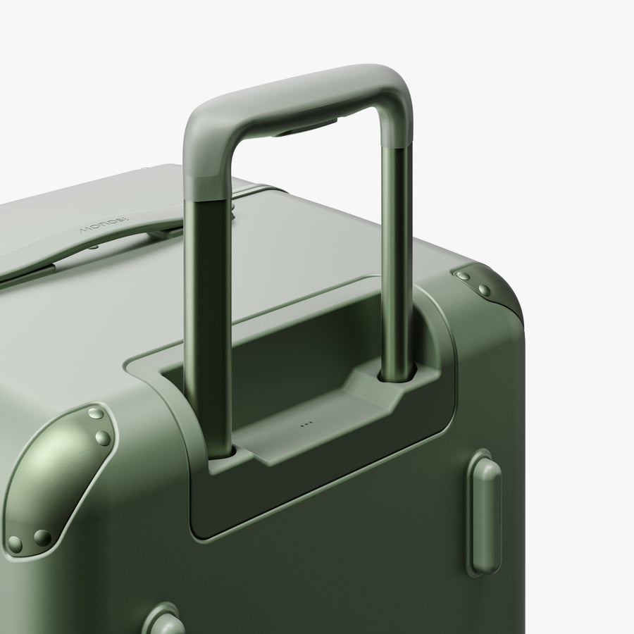 Mint | Extended luggage handle view of Hybrid Trunk in Mint