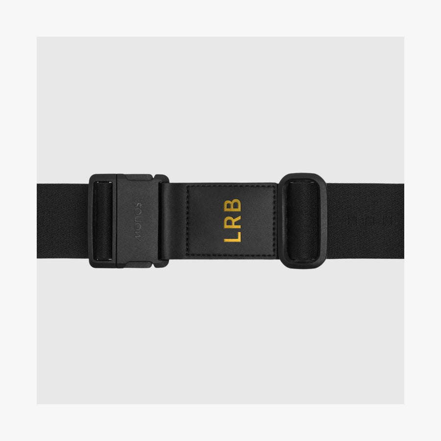 Midnight Black | Front view of an Midnight Black Luggage Strap featuring gold monogrammed letters