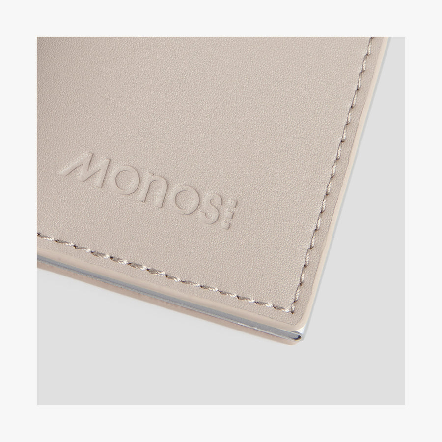 Ivory / Brushed Silver | Monos logo view of Slim Wallet Pro in Ivory / Brushed Silver