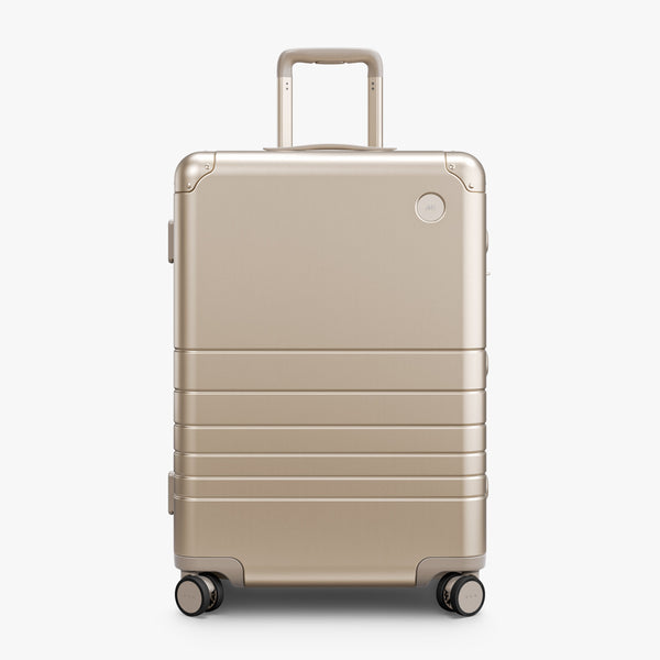 Champagne Gold | Front view of Aluminum Check-In Medium in Champagne Gold