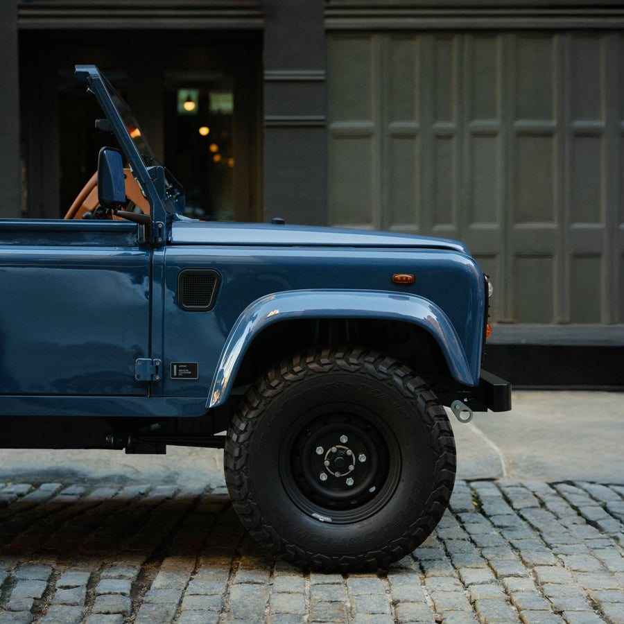 Arles Blue | Half view of Land Rover Defender on the street