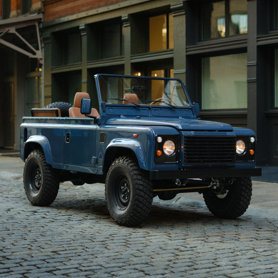 Arles Blue | Full view of Land Rover Defender on the street