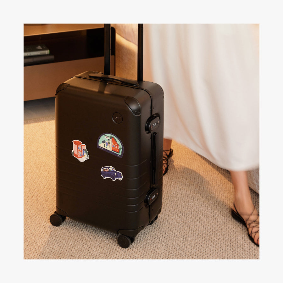 London Destination Stickers | All three stickers of London stickers set on a standing Black suitcase