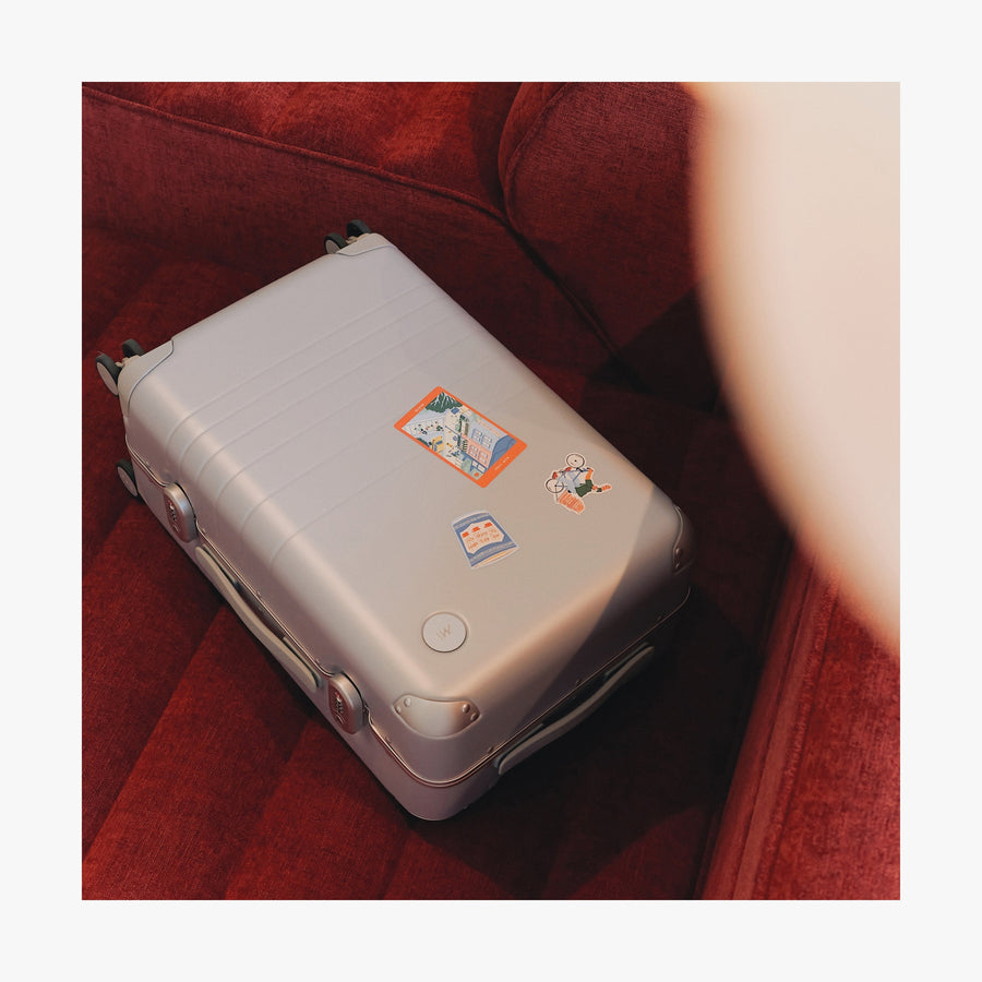 New York Destination Stickers | All three stickers of New York stickers set on a laying suitcase