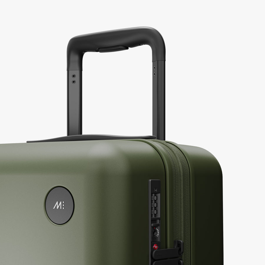 Olive Green | Luggage handle view of Expandable Carry-On in Olive Green