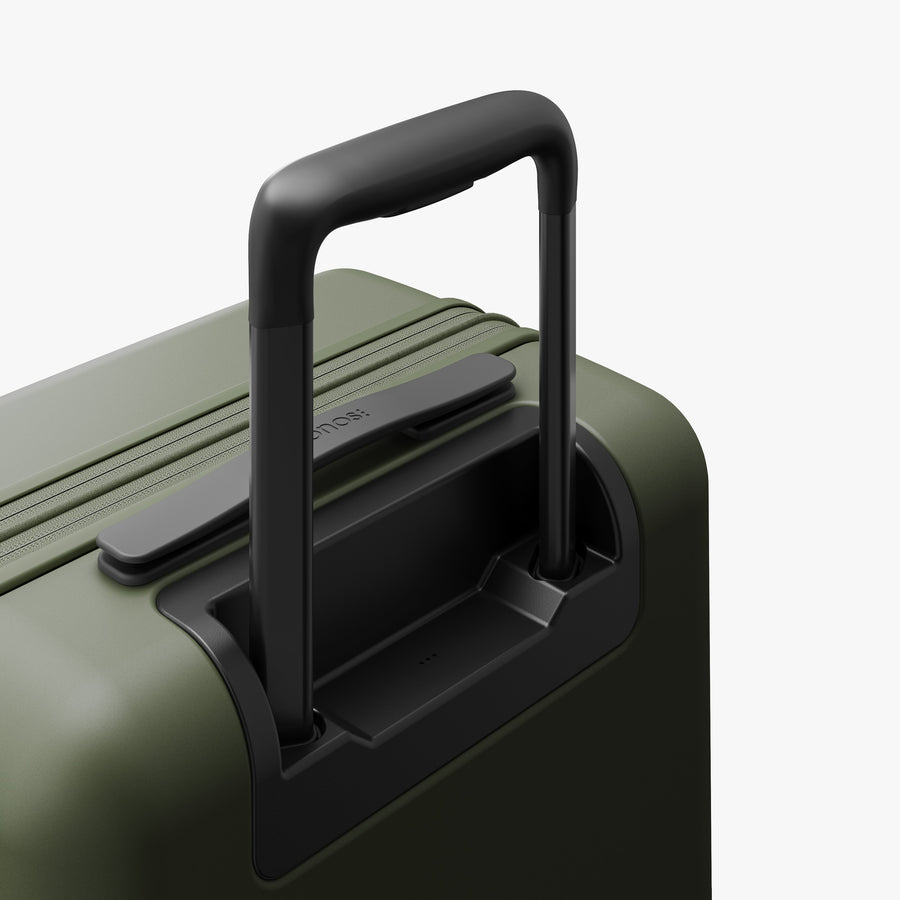 Olive Green | Extended luggage handle view of Expandable Carry-On in Olive Green