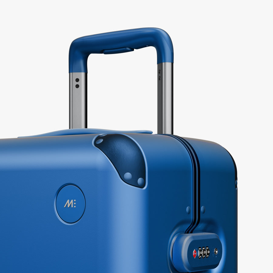 Coastal Blue | Close-up view of the logo detail on the Hybrid Carry-On Plus in Coastal Blue