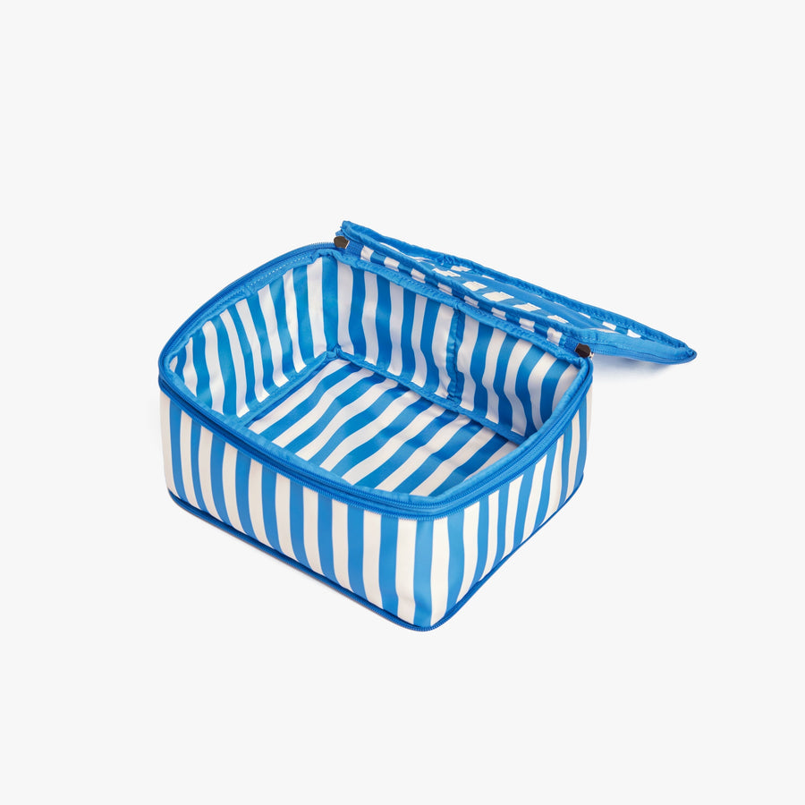 Set of Six / Poplin Stripe Coastal Blue | Open Poplin Stripe Coastal Blue compressible packing cube showing its spacious interior and structured shape