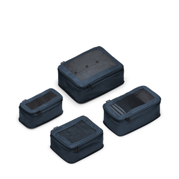 This is a photo of a set of four compressible packing cubes in Arles Blue
