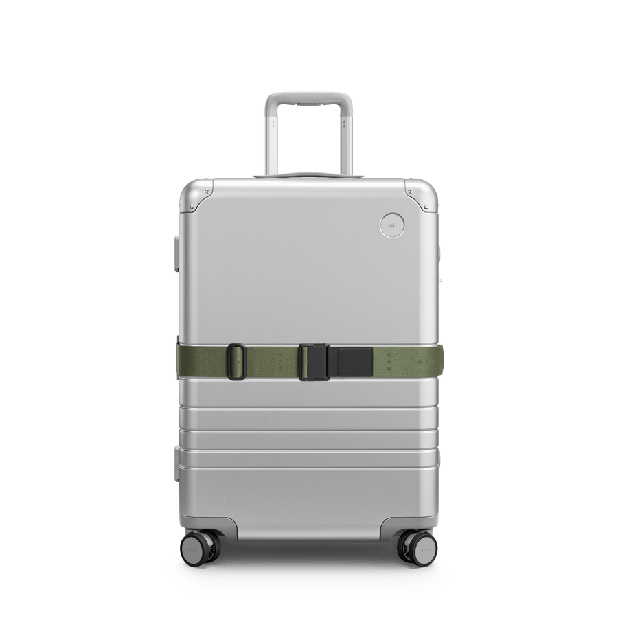 Olive Green Scaled | Front view of Aluminum suitcase with the Olive Green Luggage Strap secured around it
