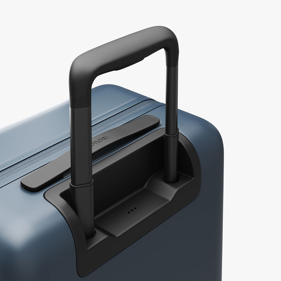 Ocean Blue | Extended luggage handle view of Carry-On Plus in Ocean Blue
