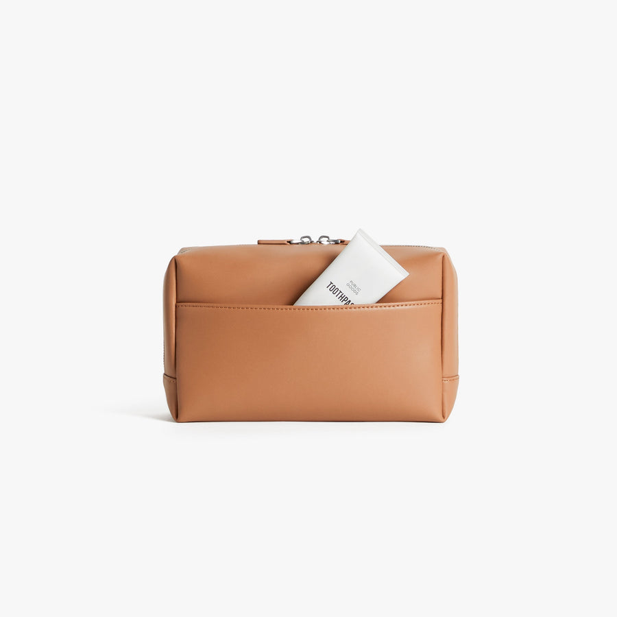 Large / Saddle Tan (Vegan Leather) | Back view showing pocket of Metro Toiletry Case Large in Saddle Tan